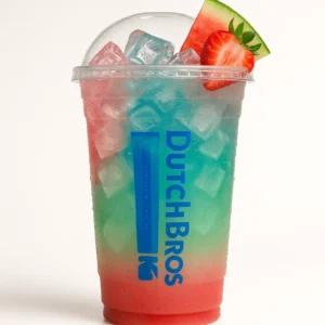 Tall clear Dutch Bros cup of layered Aqua Berry iced drink with strawberry, kiwi, blue raspberry, and watermelon flavors, fruit garnish, and white background.

