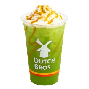 Dutch Bros Caramel Apple Rebel Green with whipped cream and caramel in a clear cup on white background

