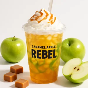 Caramel Apple Rebel Dutch Bros drink with caramel drizzle and green apple syrup in a clear cup on a white background.

