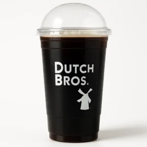  Dutch Bros Cold Brew coffee in a tall clear cup with logo on a white background