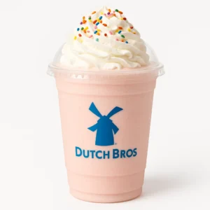 Dutch Bros Bubblegum Shake with banana, strawberry, and vanilla blend topped with whipped cream, on a white background.