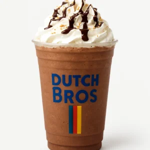 Dutch Bros Cocomo blended mocha coconut drink in a clear branded cup topped with whipped cream, chocolate drizzle, and toasted coconut flakes, isolated on white background.

