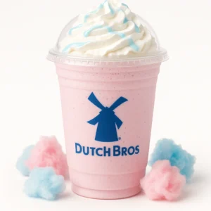 Dutch Bros Cotton Candy Shake on a white background with blue raspberry syrup, white chocolate sauce, and whipped cream.