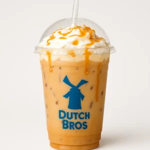 Dutch Bros Golden Eagle iced caramel breve drink in a branded clear cup with soft top and caramel drizzle on white background

