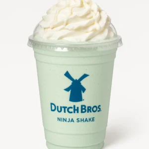 Dutch Bros Ninja Shake on a white background with creme de menthe syrup, white chocolate sauce, and whipped cream.