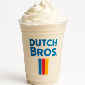Dutch Bros White Chocolate Mocha blended drink with whipped cream in a clear branded cup, on white background.

