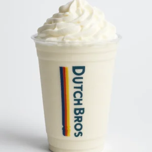 Dutch Bros White Zombie blended drink with whipped cream and white drizzle in a clear branded cup, on white background.

