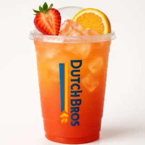 Tall clear Dutch Bros cup of bright orange-pink Fire Lizard iced drink with strawberry, banana, and orange flavors, fruit garnish, and white background.

