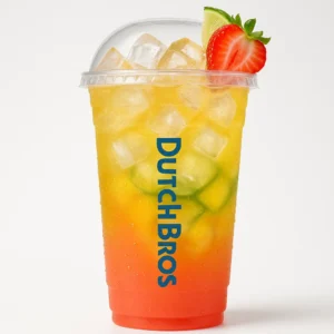 Tall clear Dutch Bros cup of layered Galaxy Fish iced drink with strawberry, lime, passion fruit flavors, fruit garnish, and white background.

