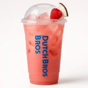 Tall clear Dutch Bros cup of bright pinkish-red Laser Cat iced drink with raspberry and coconut flavors, fruit garnish, and white background.

