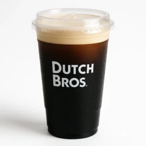 Dutch Bros Nitro Cold Brew in a clear cup with microfoam top on a white background