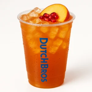 Clear plastic cup of iced tea with pomegranate and peach flavors, ice cubes, and Dutch Bros logo, white background.

