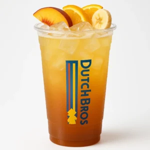Tall clear Dutch Bros cup of golden and orange layered Paris Tea iced drink with black tea, peach, passion fruit, orange, and banana flavors, fruit garnish, and white background.

