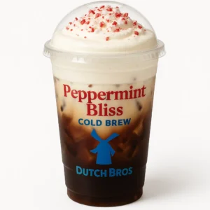 Peppermint Bliss Cold Brew from Dutch Bros in a clear cup with peppermint sprinkles on top.

