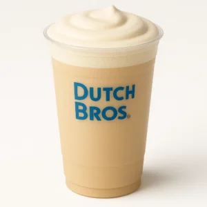 Dutch Bros Creamy Vanilla Protein Latte in a tall clear cup with smooth foam on white background