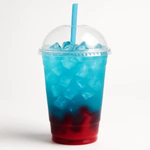 Shark Attack Rebel energy drink in ocean blue with red syrup swirl, served iced in a clear unbranded cup on a pure white background.

