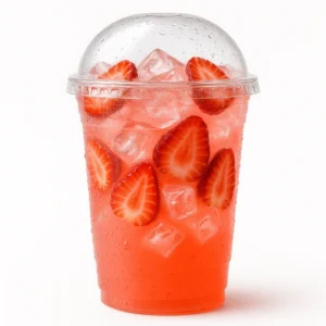 Dutch Bros Strawberry Lemonade in a premium plastic cup with dome lid and fresh strawberries on a white background.

