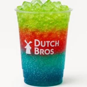 “Dutch Bros Dinosaur Egg Soda in a clear branded cup with blue, red, and green layers on a white background.”