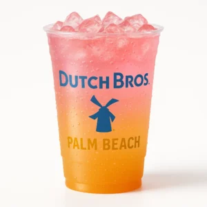 Dutch Bros Palm Beach Sparkling Soda in a clear branded cup with pink and orange tones on a white background.”